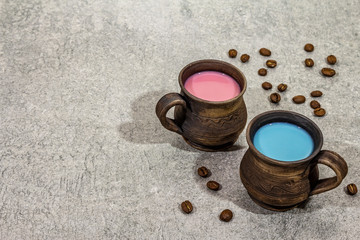 Obraz na płótnie Canvas Trendy drink blue and pink latte. Lavender or spirulina and rose, beetroot or raspberry coffee. Stone concrete background