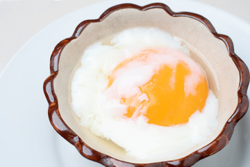 Japanese Onsen Eggs, Onsen Eggs in a Hot Cream Ceramic Cup At Chae Son National Park, Lampang Province, traditional methods of boiling eggs in natural hot springs in Thailand, healthy breakfast.