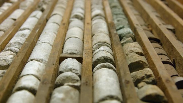 Drill core samples from geological borehole in wooden box