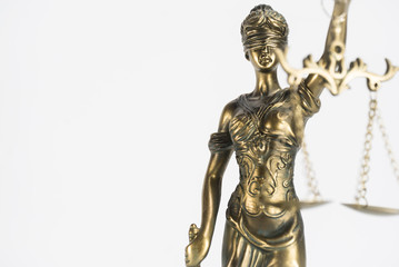 Fototapeta na wymiar Statue of justice. Law and justice concept. White background with copy space.