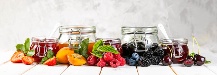 Selection of berry jams in glass jars. Home made desserts