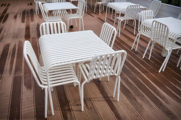Lattice furniture in the cafe, white tables and chairs
