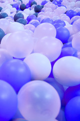 Background of blue and white plastic balls, close-up
