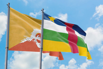 Central African Republic and Bhutan flags waving in the wind against white cloudy blue sky together. Diplomacy concept, international relations.