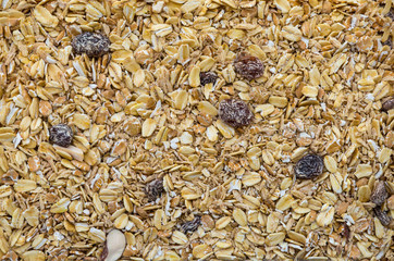 Top view, oat, bran and macadamia corn flake breakfast cereal, bran cereal with raisins, natural granola with fruits and nuts.