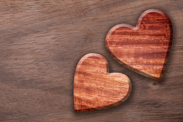 Fototapeta na wymiar Two wooden heart shaped ,Wood heart shape background.