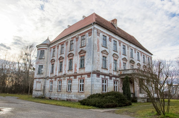 Fototapeta na wymiar Ancient German three-story palace  in the Szczepanow (Szczepanów) village, Sredzki (Średzki) poviat, Lower Silesia, Poland