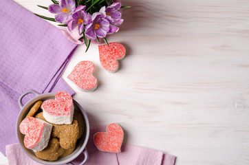nice cookies in the form of heart on a wooden table