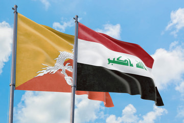 Iraq and Bhutan flags waving in the wind against white cloudy blue sky together. Diplomacy concept, international relations.