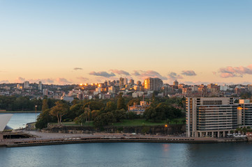 Aerial view of Sydney circular Quay and city suburbs with park at sunrise