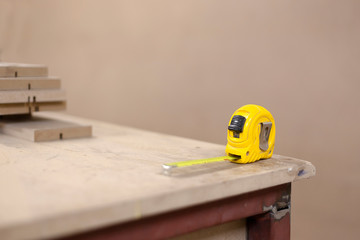 Measure on work table in the carpentry