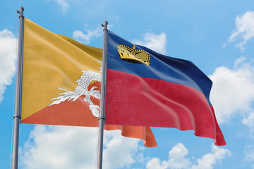 Liechtenstein and Bhutan flags waving in the wind against white cloudy blue sky together. Diplomacy concept, international relations.