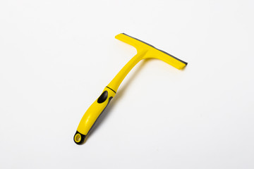Window scraper on a white isolated background. Cleaning concept. Banner. Flat lay, top view