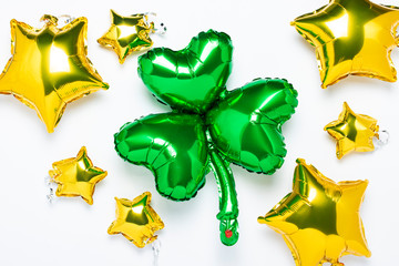 Balloon Clover and Air Golden balloons star shape on a white background. Concept holiday, party,...