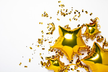 Air golden balloons star and confetti shape on a white background. Concept of a holiday, party,...