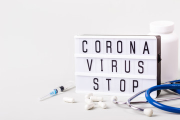 Lightboard with words Coronavirus stop. Severe acute respiratory syndrome. Coronavirus treatment...
