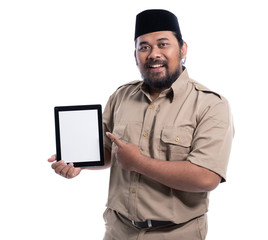 asian worker with brown uniform pointing to blank screen tablet pc. pns pegawai negeri sipil