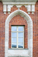 Antique window on a brick wall, closeup