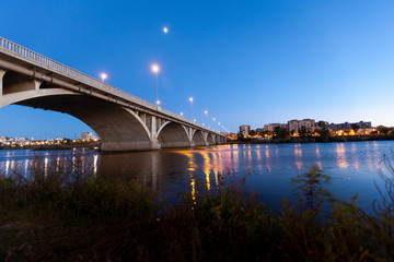 river with bridge in the foreground city background
