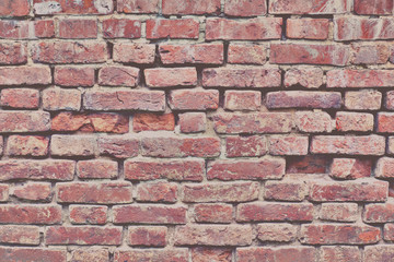 Background of cracked brick wall, texture of destroyed brickwork