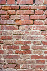 Old brick wall background, texture of crumbling brickwork wall