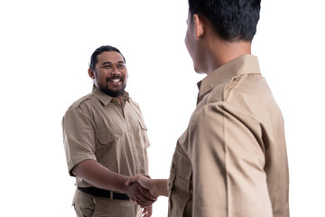 two team indonesian government worker shaking hand together isolated over white