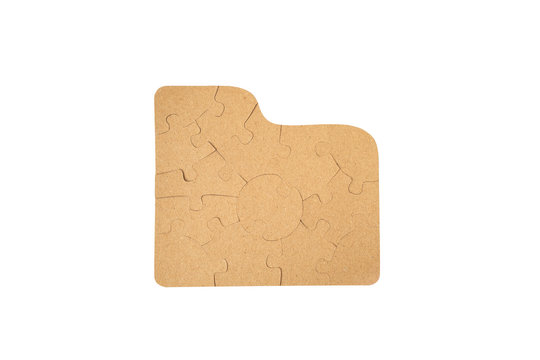 Pieces of cardboard puzzles isolated on white background.