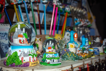 Colored souvenirs from Alberobello, South of Italy on Blurred background