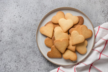 Valentines day greeting card with heart shaped cookies on grey stone table. - obrazy, fototapety, plakaty
