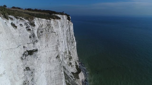 Aerial footage flight past the White Cliffs of Dover part of the North Downs formation is the name given to the region of English coastline facing the Strait ocean and France 4k high resolution