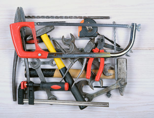  hand tools: hammer, saw, adjustable wrench, screwdriver, open-end wrenches, pliers, etc.