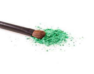 Make-up brush and powdered cosmetics isolated on white background