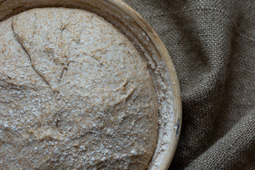 Proofing dough in a special basket. Raise the dough before baking. Yeast-free dough. The fermentation process of the dough.