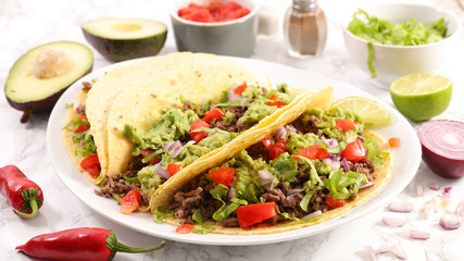 tortilla bread with minced beef, avocado and tomato