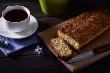 Pie with violet hyacinth on the wooden background