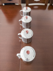 metal cups lined up on the table