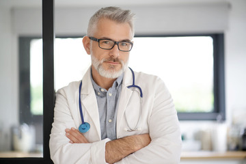 Portrait of mature doctor with eyeglasses