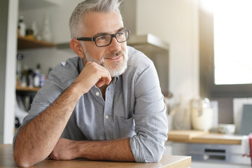 Portrait of smiling mature man with glasses