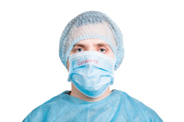 Portrait of young man wearing medical uniform and protective mask with epidemic word isolated on white background. Coronavirus and health care concept