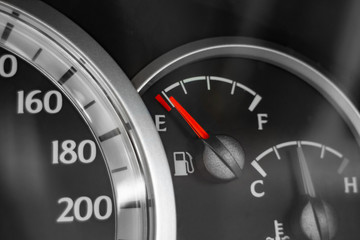Fototapeta premium Close-up of car dashboard showing speedometer, fuel indicator and temperature indicator.