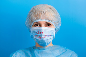Portrait of woman wearing medical uniform and mask with China quarantine text at blue background. Protect your health. Coronavirus concept
