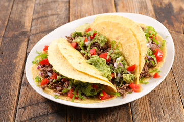 tortilla bread with minced beef, avocado and tomato