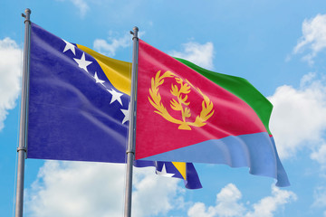 Fototapeta na wymiar Eritrea and Bosnia Herzegovina flags waving in the wind against white cloudy blue sky together. Diplomacy concept, international relations.