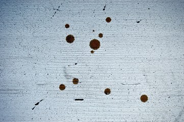 Horizontal background of dirty white wooden surface with scuff and round brown spots