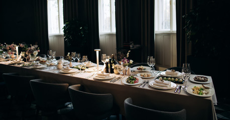 Elegant table set with food for a romantic dinner. Catering, hospitality and private dining