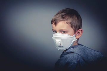boy wears a protective medical mask
