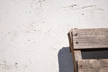 Gray wall texture and wooden object