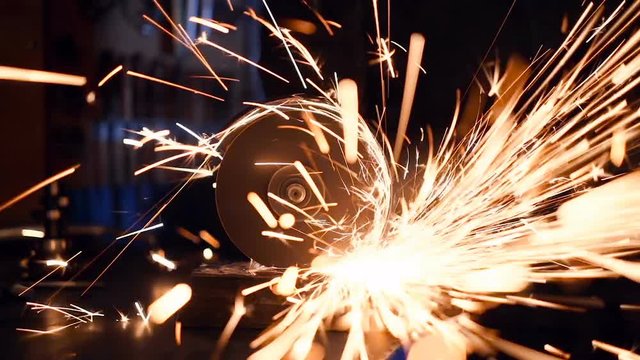 Circular ginder disk with a lot of sparks. Slowmotion.