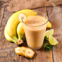 banana smoothie on wood background