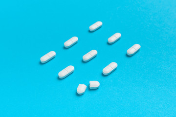 Film coated white oval pills